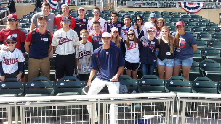 Twins pitcher, Kyle Gibson, with group of Fellowship of Christian Athletes students at Target Field