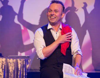 andrew green magician on stage