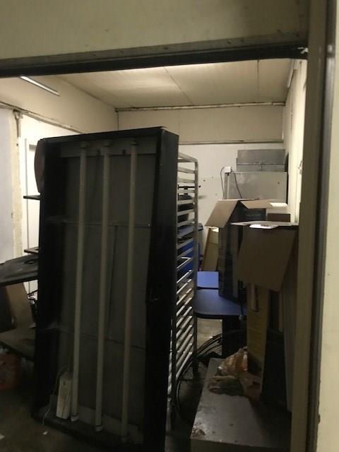 A room with a lot of boxes on the floor