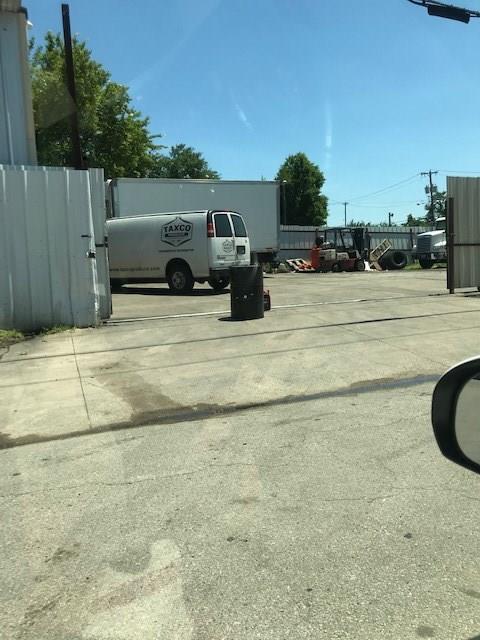 A white van is parked in a parking lot