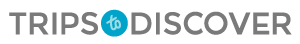 a blurry picture of the word trips to discover