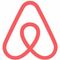 The airbnb logo is a red triangle with a heart in the middle.