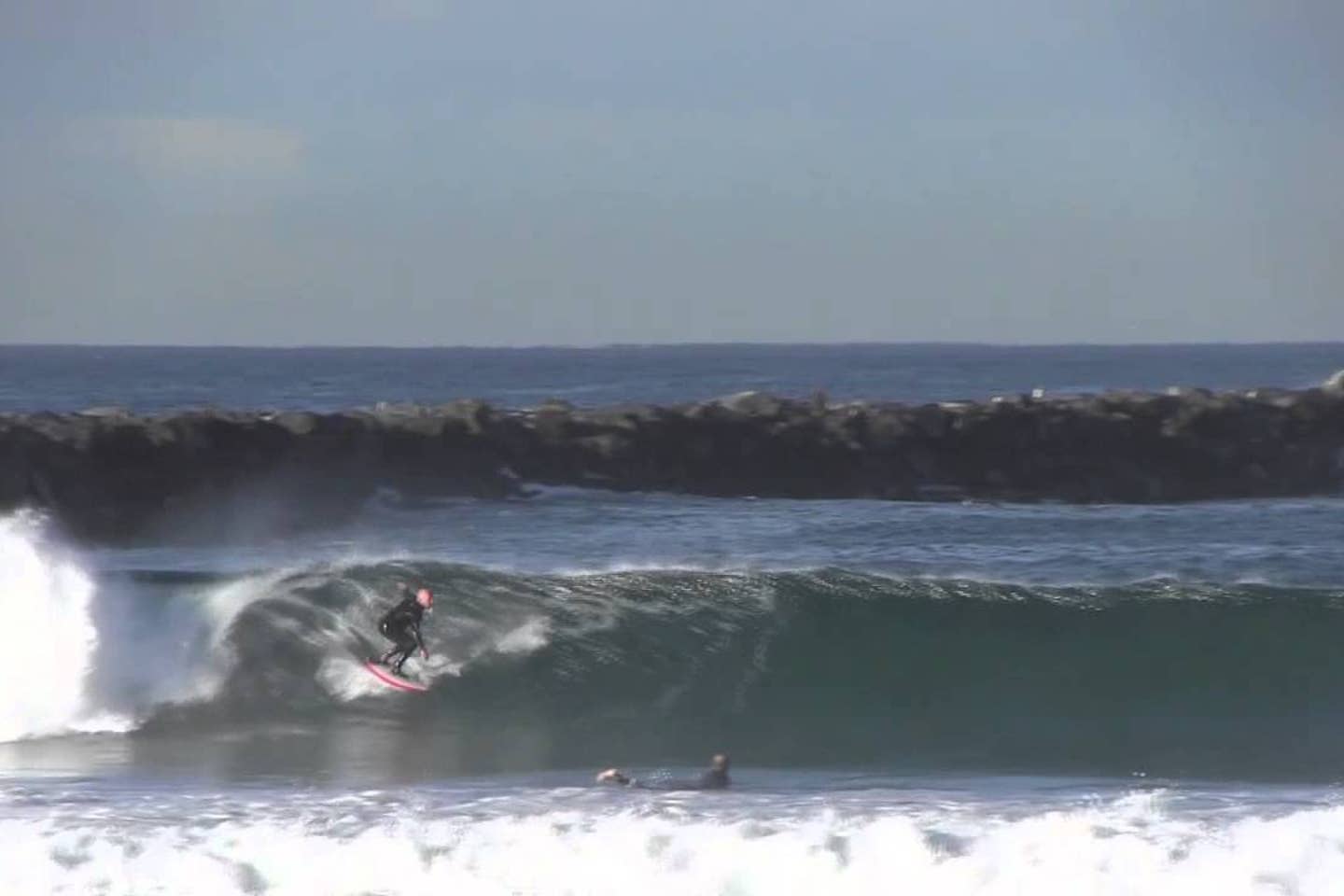 A surfer is riding a wave in the ocean.