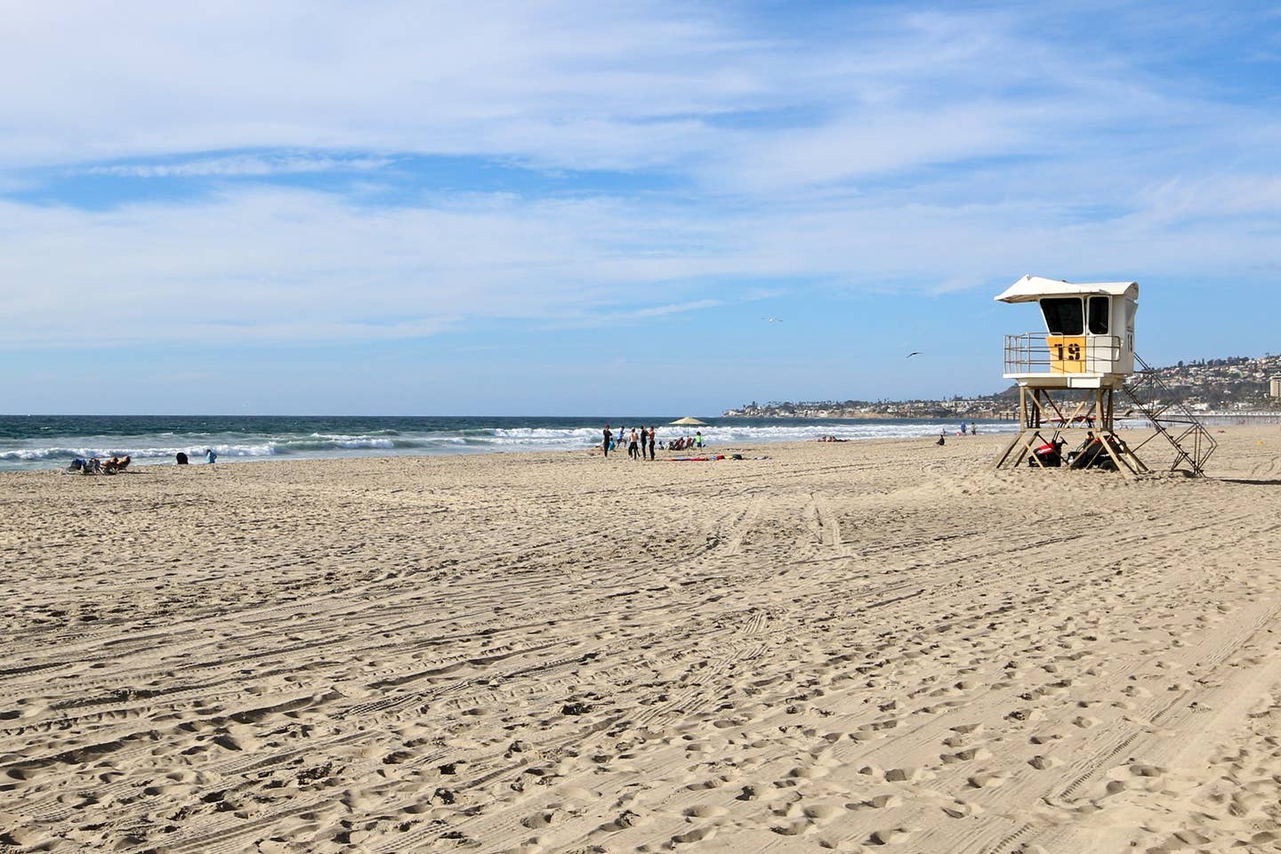 There is a lifeguard tower on the beach.