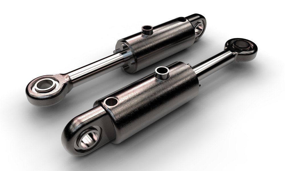 Zwei Hydraulikzylinder stehen nebeneinander auf einer weißen Fläche.