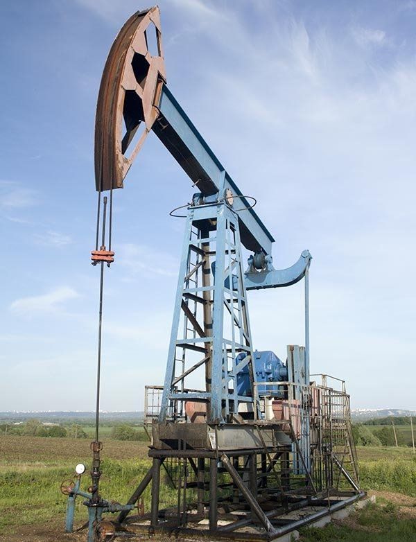 Oil Pump Jack on a Field — Water Boring in Dubbo, NSW Oil Pump Jack on a Field — Water Boring in Dubbo, NSW