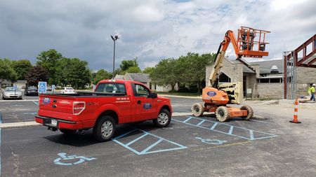 Construction Workers in Front of Red Truck — Fort Wayne, IN — Strebig Construction, Inc. Construction Workers in Front of Red Truck — Fort Wayne, IN — Strebig Construction, Inc.