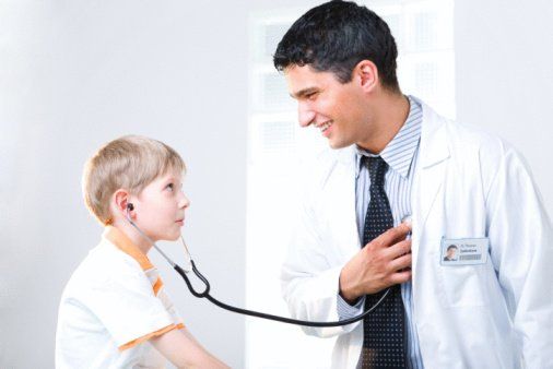Young Girl Being Held By Female Pediatric Doctor in Fredericksburg, VA