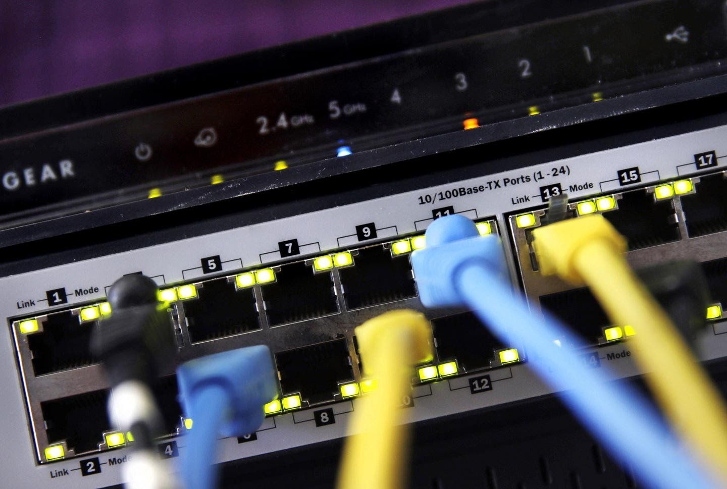 A router with a bunch of wires connected to it