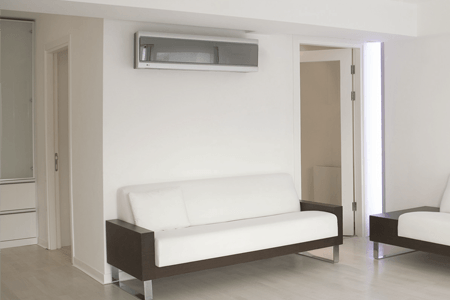 AC installed on the wall of a living room