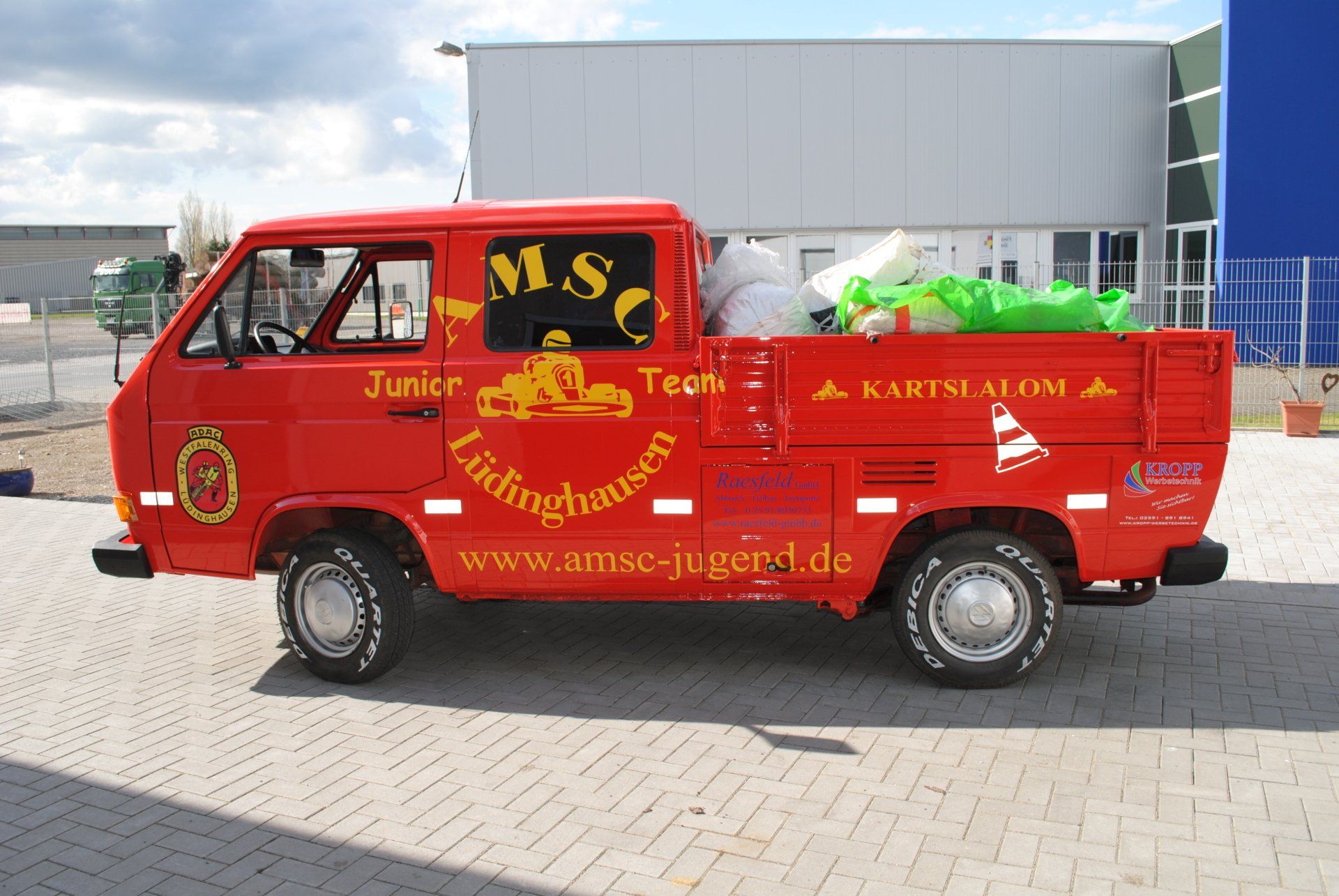 A red truck with the word junk on the side