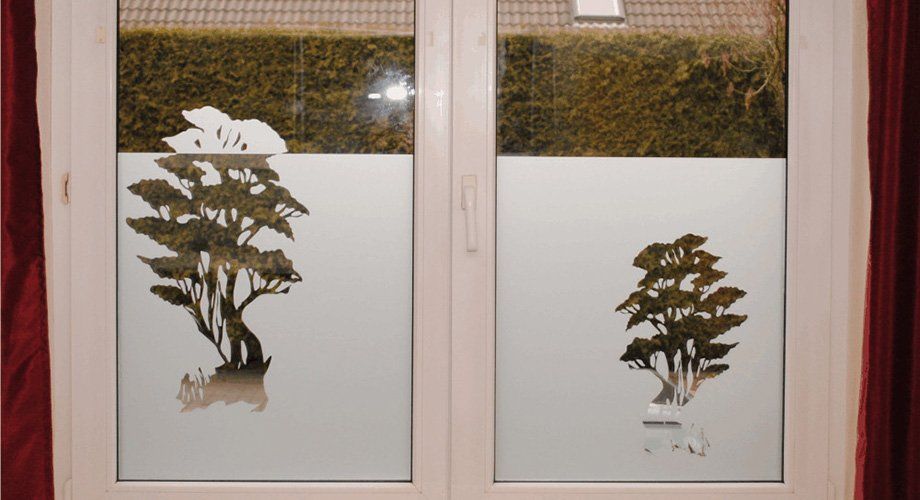 A window with a picture of a tree on it