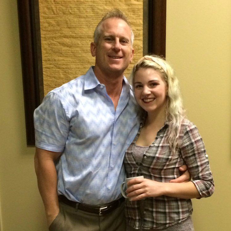 A man and a woman are posing for a picture