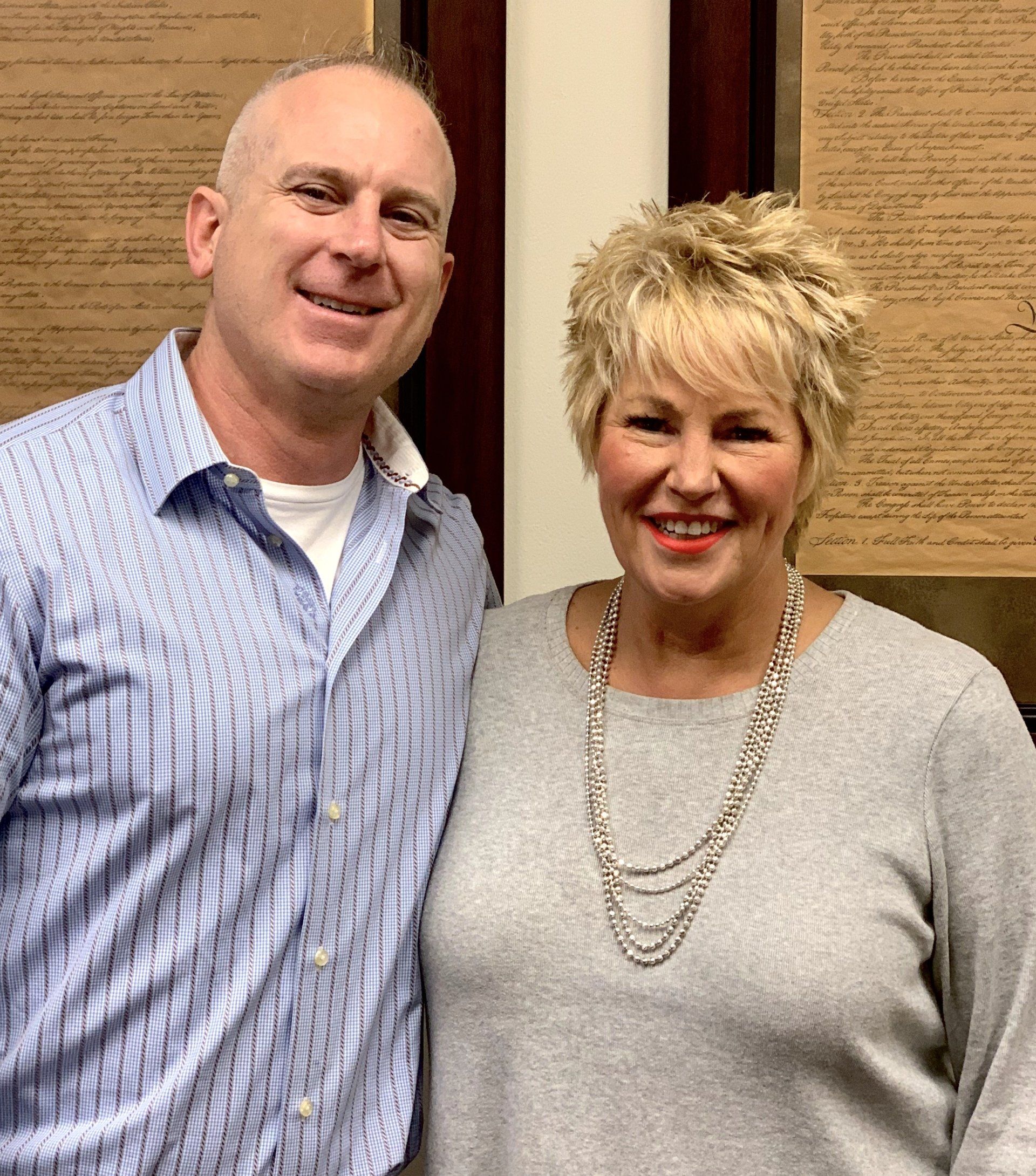 A man and a woman are posing for a picture together.