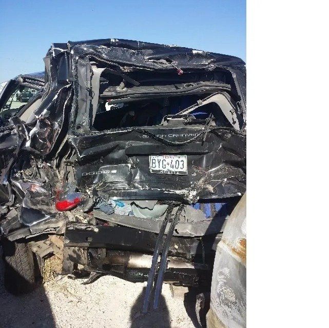 A wrecked car with a license plate that says btc-403