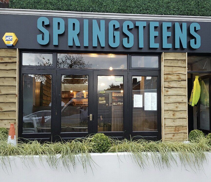 A store front with a sign that says springsteens