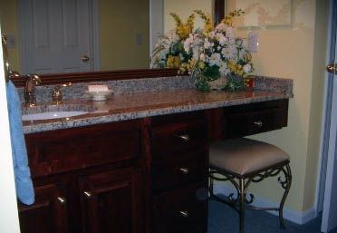 bathroom sink, flowers and stool