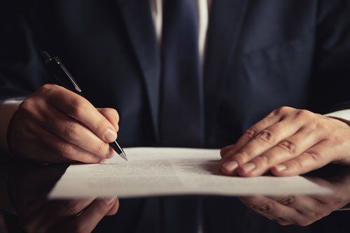 Attorney Signing A Contract — Ocala, FL — Law Office of W. Michael Parrott, PLLC