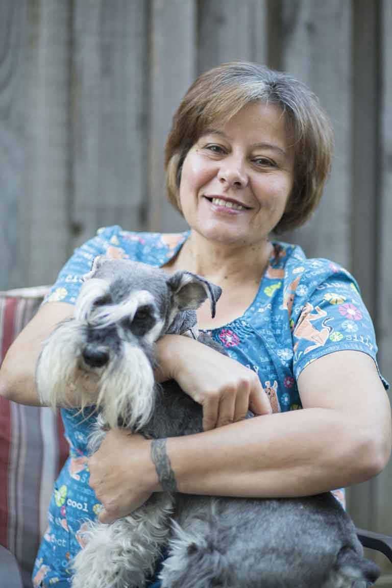 Schnauzer — Woman Hugging Her Miniature Schnauzer in Citrus Heights
