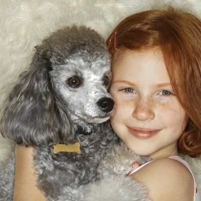 Poodle — Child Hugging Her Poodle in Citrus Heights, CA