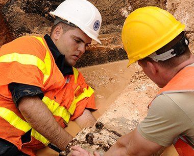 Two Plumber Fixing Old Pipe Line