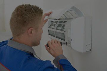 Technician Fixing Air Conditioner - Air Conditioning in Killeen, TX Technician Fixing Air Conditioner - Air Conditioning in Killeen, TX