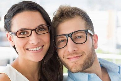 Attractive young couple wearing glasses - Eye Doctor in Holiday, FL Attractive young couple wearing glasses - Eye Doctor in Holiday, FL