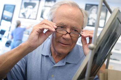 Man in an optical store - Eye Doctor in Holiday, FL Man in an optical store - Eye Doctor in Holiday, FL