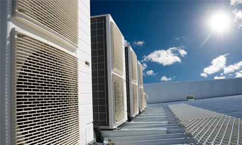 Air conditioner units with sun — Commercial Air Conditioning in Pueblo, CO Air conditioner units with sun — Commercial Air Conditioning in Pueblo, CO