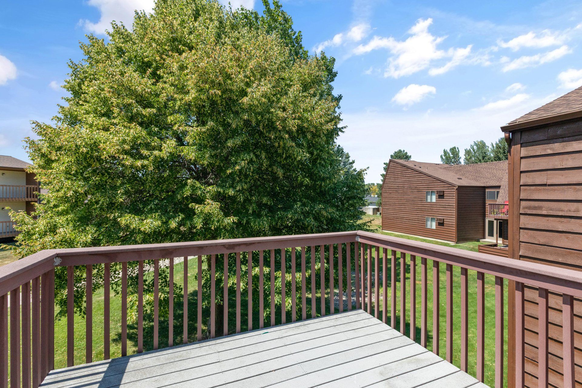 Alternate view from deck overlooking grass area and walkway