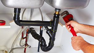 Plumber Replacing Kitchen Sink Faucet — Residential Plumber in Baton Rouge, LA Plumbing in Greenwell Springs — Residential Plumber in Baton Rouge, LA
