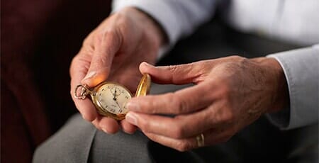 Senior Man Holding Old Pocket Watch — Watch Repair in Brighton, CO Senior Man Holding Old Pocket Watch — Watch Repair in Brighton, CO