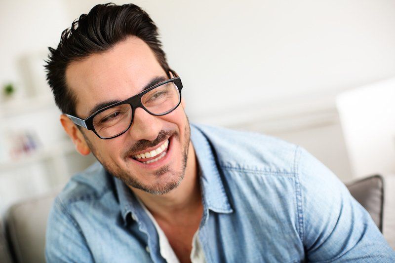 A man with beautiful smile - dental crowns tuscaloosa 35401 