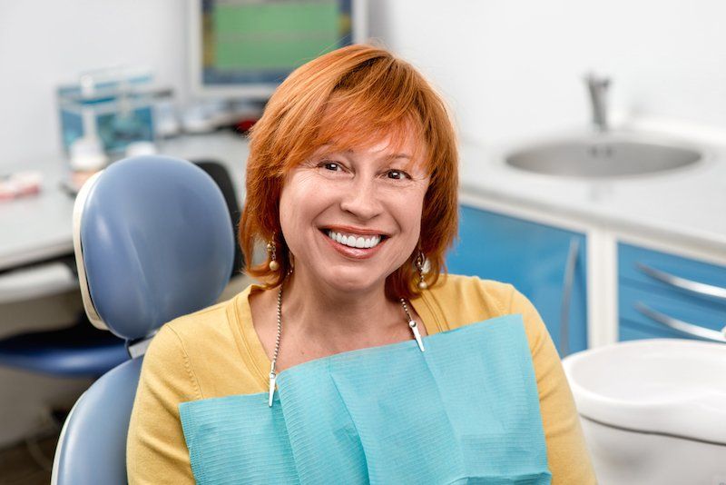 A patient sitting in a dental chair - gum disease dentist tuscaloosa al