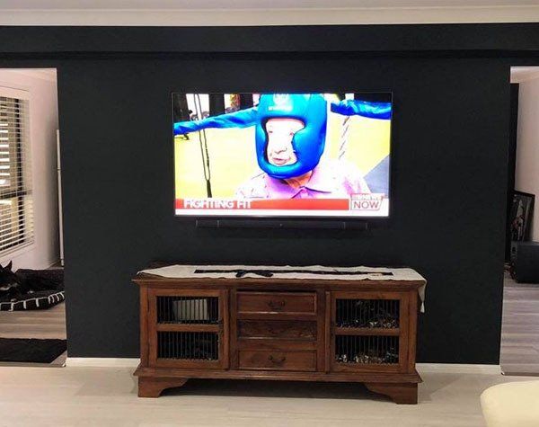 TV mounted to wall TV mounted to wall