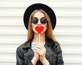 Adjustments — Woman Holding a Heart-shaped Lollipop in San Rafael, CA Adjustments — Woman Holding a Heart-shaped Lollipop in San Rafael, CA