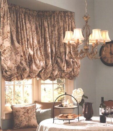A dining room with a table and a clock on the wall