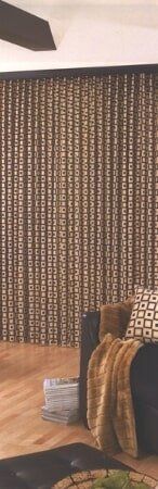 A living room with a couch , chair , table and curtains.