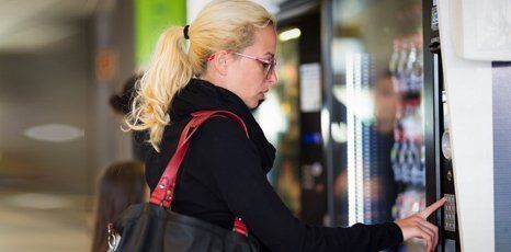 A woman using a vending machine