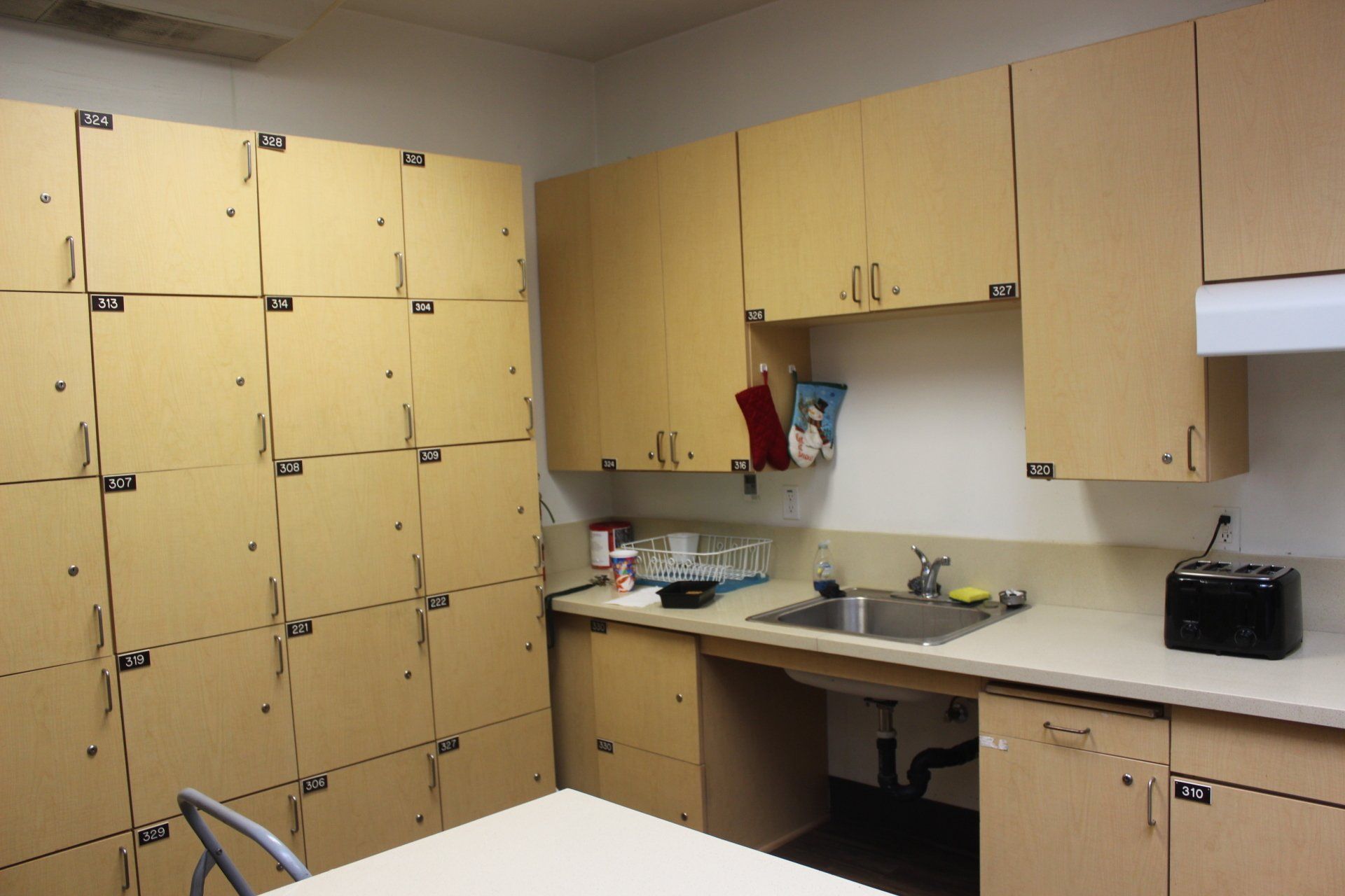A kitchen with lots of cabinets and a sink