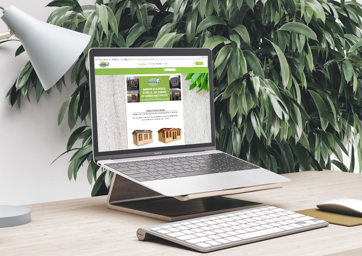 a laptop is sitting on a desk next to a lamp and keyboard .