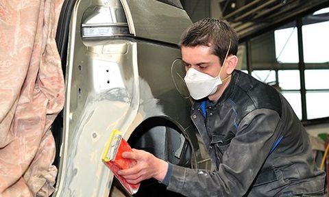 Collision Repair — Auto Worker Finishing Car Damaged in Dover, OH Collision Repair — Auto Worker Finishing Car Damaged in Dover, OH