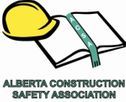 Yellow hard hat on an open book, ribbon reading 