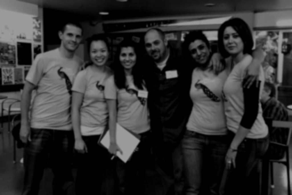 A black and white photo of a group of people posing for a picture
