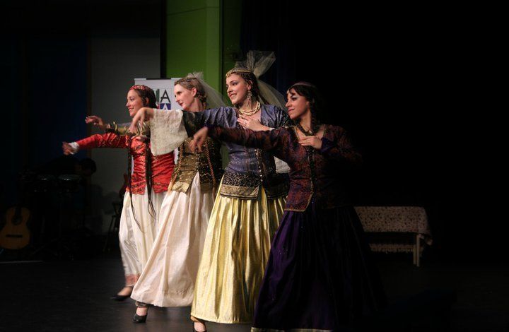A group of women are dancing on a stage.