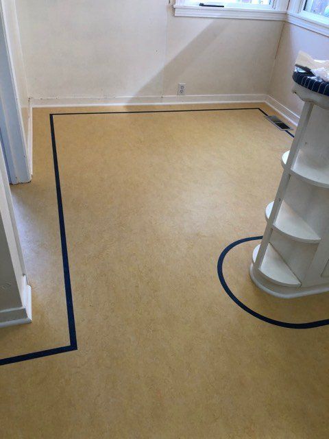 Forbo Marmoleum  Color; #3846 with a feature strip color #3030