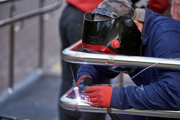 a worker installing railings