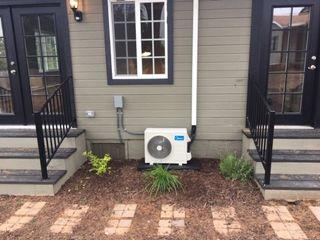 Air Conditioning Services — Technician Repairing HVAC Unit in Menifee, CA