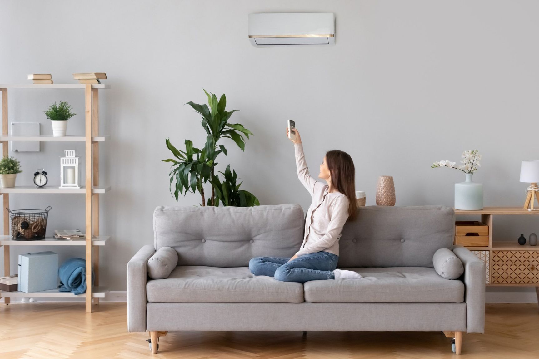 women turning on AC