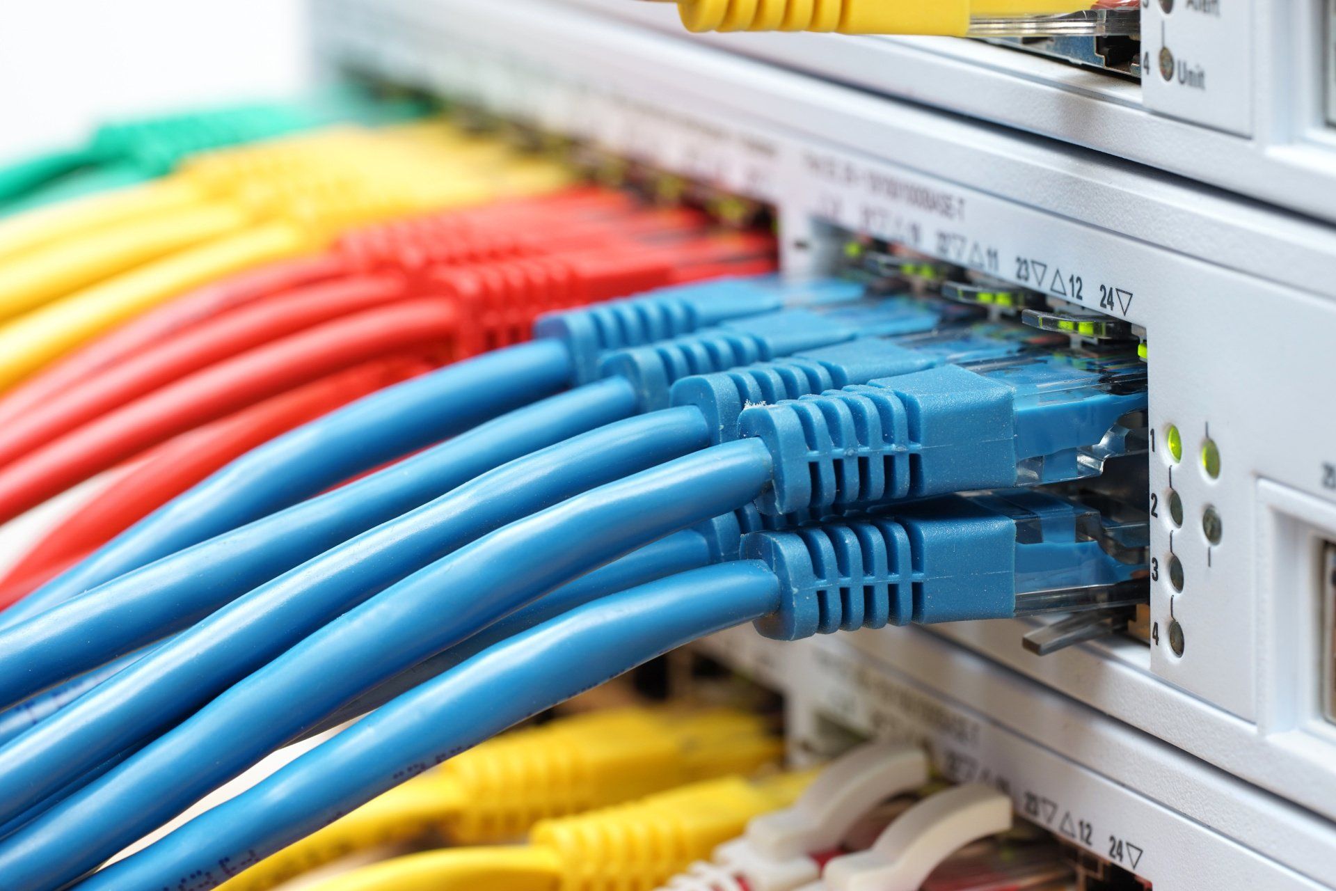 A bunch of colorful wires are connected to a server